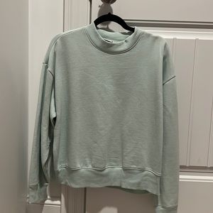 A new day light green crewneck sweater